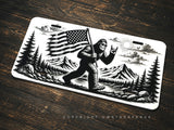Bigfoot Mountains Forest USA American Flag Humor Auto License Plate